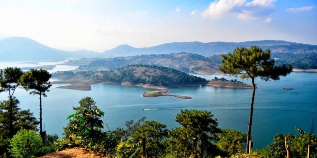 serene Umiam Lake surrounded by green hills near Shillong Meghalaya